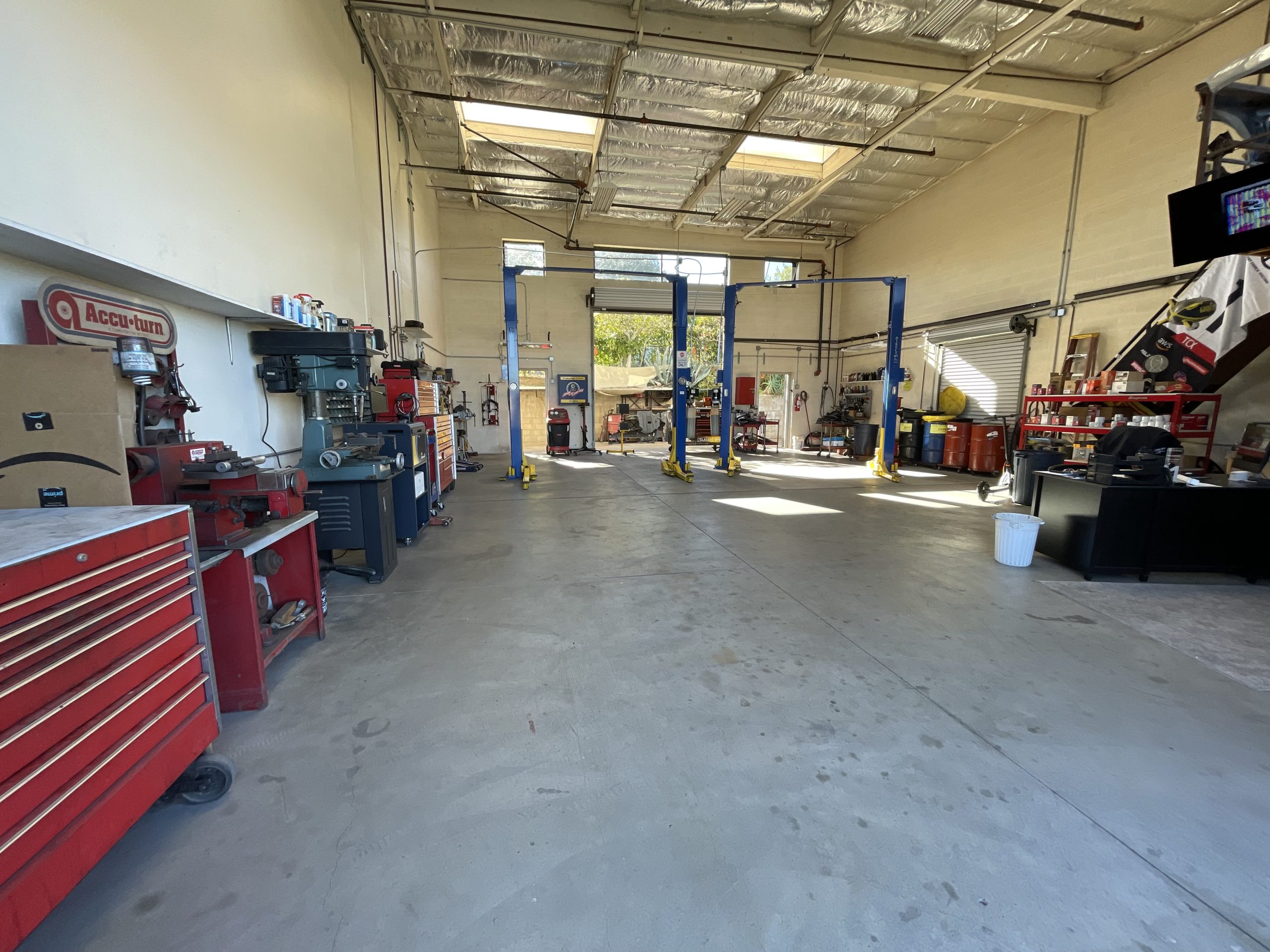 Nick's Auto Service & Smog shop bays with lifts, ready for your appointment
