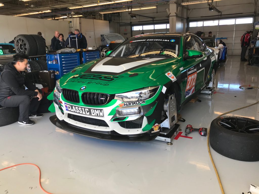 Classic BMW M4 GT4 in the garage between sessions