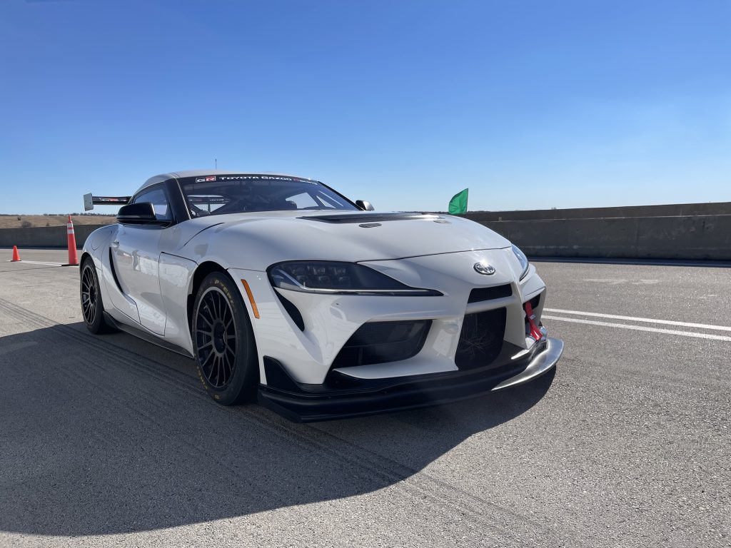 Toyota GR Supra GT4 race car on pit lane