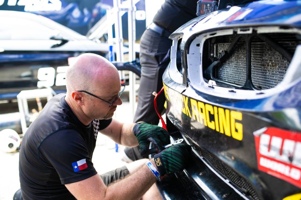 Nick wrenching on the Fast Track Racing BMW M4 in the pit lane